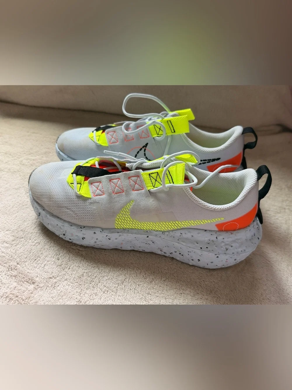 Nike Women’s White Athletic Shoes with Neon Yellow and Orange Accents
